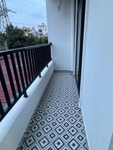 a balcony with black and white flooring at Lighthouse Apartment in Ða Gia +2 photos
