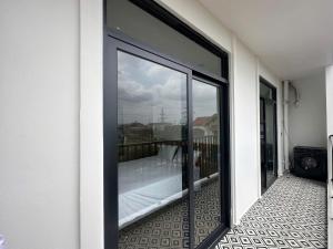 a sliding glass door with a view of a balcony at Lighthouse Apartment in Ða Gia