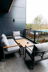 a room with two chairs and a table and a window at Relax Resort in Reshetilovskiy Kut