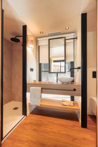a bathroom with a sink and a mirror at L'Acciola in Evisa