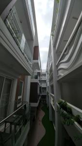 an empty hallway of an apartment building with a green floor at Boracay Haven Suites in Boracay
