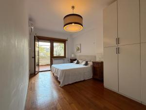 a bedroom with a bed and a large window at Gt holiday in Rome