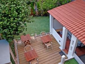 an aerial view of a deck with chairs and a house at mundoalbergue in Santiago de Compostela