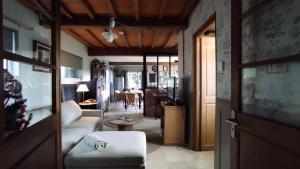 a living room with a couch and a table at Le Clos de Marenla in Marenla