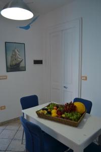 a tray of fruit on a table in a room at Salento holiday house in Torchiarolo