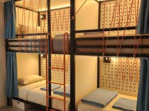 a couple of bunk beds in a room at HI Poitiers - La Caserne in Poitiers
