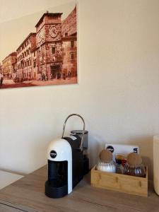 a toaster sitting on top of a wooden table at Verica in Dobrota