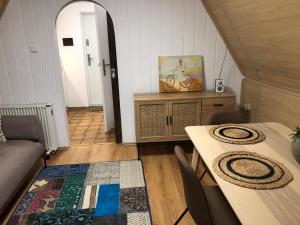 a living room with a table and a dining room at Ferienhaus Plöwen MV in Plöwen