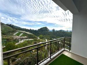 a balcony with a view of a valley at PLAY at Nova Retreat Kea Farm in Cameron Highlands