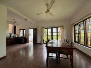 a large living room with a table and some windows at The fields Malabe in Malabe
