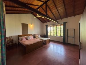a bedroom with a bed and a table in a room at The fields Malabe in Malabe