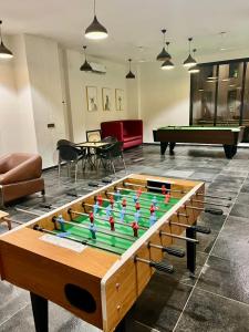 a pool table in a living room with a pool table at Weekend villa in Rajkot
