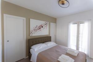 a bedroom with a large bed with two white pillows at ZENIT Appartamenti & SPA in Terni +25 photos