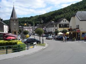 a small town with a church and a street with cars at vakantiewoning Charme Bohan Sur Semois in Vresse-sur-Semois