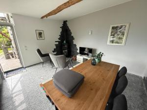 a living room with a table and a christmas tree at Romantic Ticino Rustici in Gordola