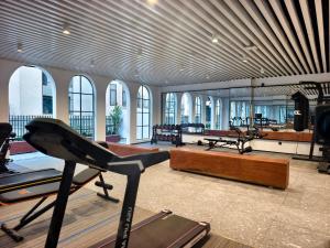a gym with several exercise equipment in a building at Glond Hotel in Luang Prabang