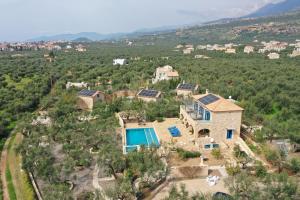 an aerial view of a house with a swimming pool at Pantazi Beach House in Kotrónion