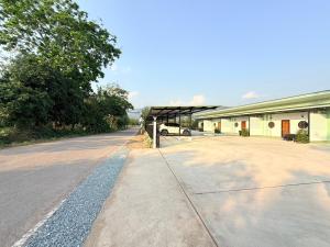 an empty road in front of a building at Khaochamao View in Ban Nam Pen