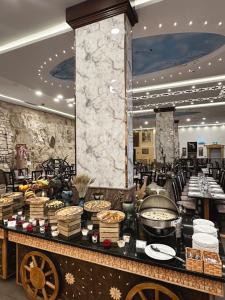 a buffet of food on a table in a restaurant at Petra Canyon Hotel in Wadi Musa