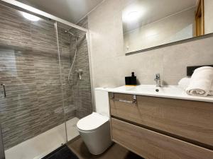 a bathroom with a shower and a toilet and a sink at Villmor - B39 - Rabason in Benasque +16 photos