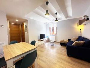 a living room with a couch and a table at Villmor - B39 - Rabason in Benasque