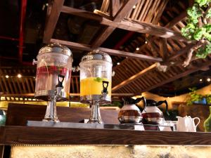 two glasses of drinks sitting on a bar at SUPER HOTEL HANOI - Grand Opening in 17 March 2026 in Hanoi