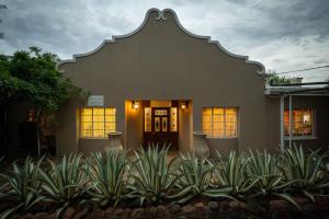 a house with a large spanish style building at Van Zylsvlei - A Karoo Guest Farm in Colesberg