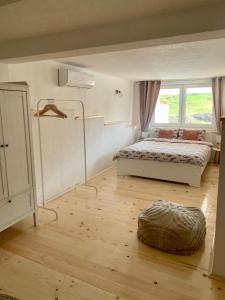 a bedroom with a bed and a large window at Sokograd Royal in Šipovo +72 photos