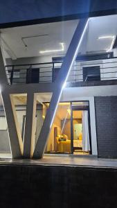 a view of a building with a living room at Questro Apartment Hotel in eNyamazaneni +13 photos