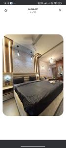 a bedroom with a large bed in a room at spice villa hotel in Gajar