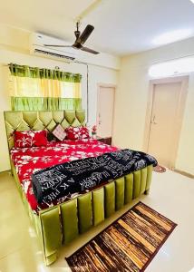 a bedroom with a large bed in a room at spice villa hotel in Gajar