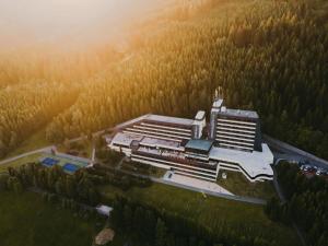 an aerial view of a building in the middle of a forest at OREA Resort Horal Špindlerův Mlýn in Špindlerův Mlýn
