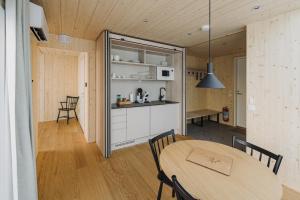 a kitchen and dining room with a table and chairs at Northern Lights Ranch in Levi