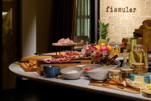 a table with many different types of food on it at Serras Sevilla in Seville +24 photos