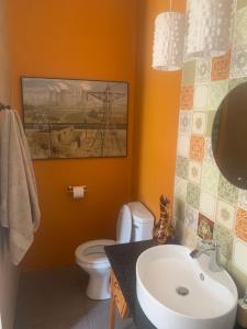 a bathroom with a sink and a toilet at The Gables Guest House in Belfast +32 photos