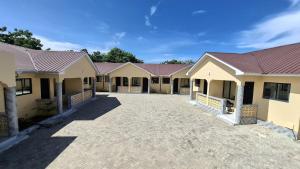a row of houses with red roofs at Westwood Homes in Kilifi