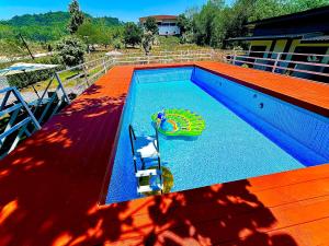 a swimming pool with a toy in the middle of it at Da Airport Hotel in Nai Yang Beach