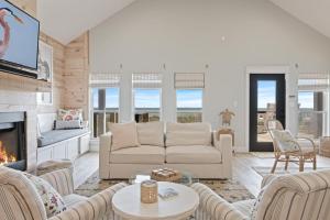 a living room with a couch and a fireplace at Gulf State home in Crystal Beach