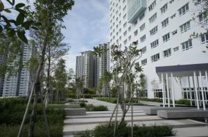 a building with a courtyard with trees and buildings at Pearl Regency Super Condominium in Gelugor