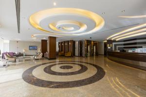 a large lobby with a large circular ceiling at Topaz Serviced Apartments in Riyadh