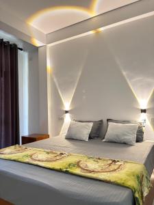 a bedroom with a large bed with two pillows at Ella Heaven View in Ella +29 photos