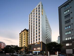 a tall building in the middle of a city at SUPER HOTEL HANOI - Grand Opening in 17 March 2026 in Hanoi