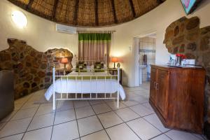 a bedroom with a bed in a room at Van Zylsvlei - A Karoo Guest Farm in Colesberg