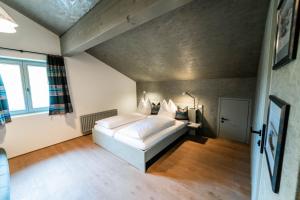 a bedroom with a white bed in a room at FAT Mankei in Seidlwinkl