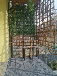 a wooden table and chair sitting on a patio at Gościniec nad Olzą in Cieszyn