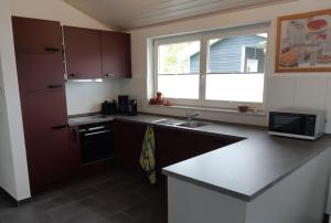 a kitchen with a sink and a counter top at Ferienhaus Happy Days in Nordhorn