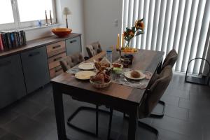 a dining room table with food on top of it at Ferienhaus Happy Days in Nordhorn