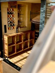 a room with a wine cellar with wine bottles at Apartamentos Flores playa in La Mata +51 photos