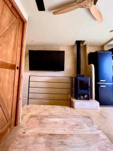 a living room with a stove and a tv at Apartamentos Flores playa in La Mata