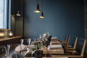 a long table in a room with chairs and lights at Radisson Blu Royal Hotel, Helsinki in Helsinki